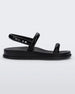 Side view of a black Melissa Soft Wave Sandal with a front and ankle strap.