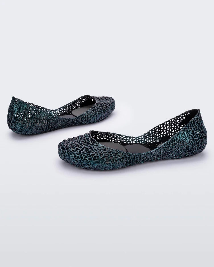 Angled view of a pair of blue Melissa Campana ballet flats.