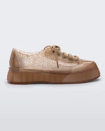 Side view of a clear beige Drive sneaker
