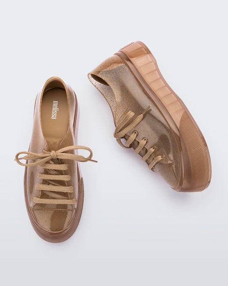 Top and side view of a clear beige Drive Sneaker