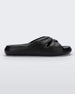 Side view of a black Melissa Free Slide with a twist front detail.