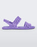 Side view of a purple Melissa Panc Sandal with crocheted straps.