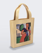 An Adult Melissa Canvas + Tarsila Do Amaral Bag with a picture of a woman on it.