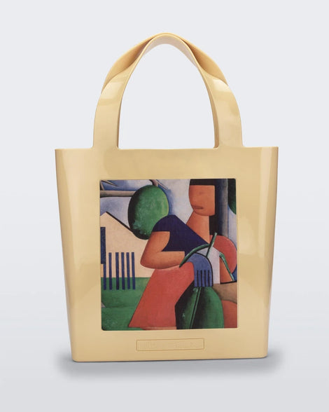 An Adult Melissa Canvas + Tarsila Do Amaral Bag with a picture of a woman on it.