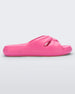 Side view of a pink Melissa Free Slide with a twist front detail.