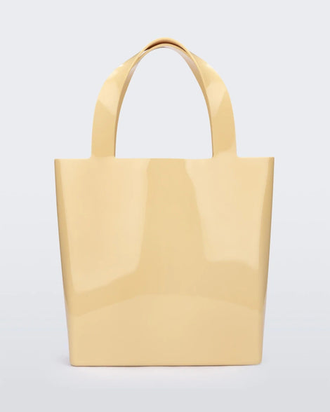 An Adult Melissa Canvas + Tarsila Do Amaral Bag in yellow on a white background.