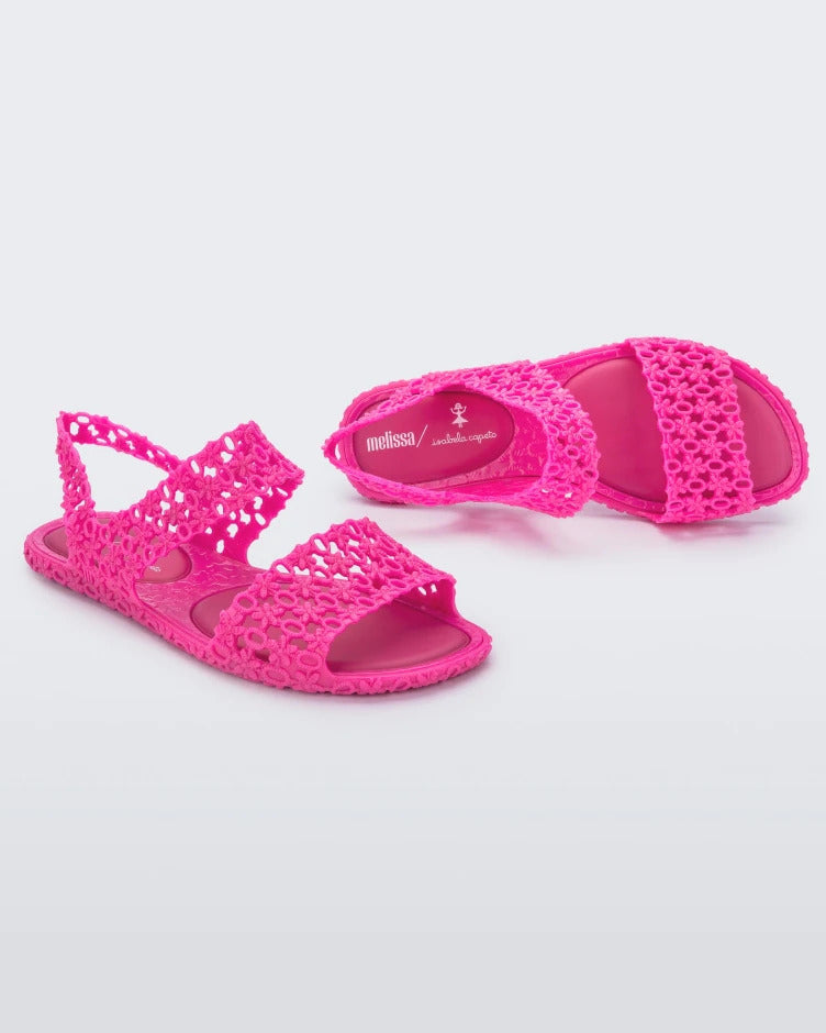 Angled and top view of a pair of pink Melissa Panc Sandals.
