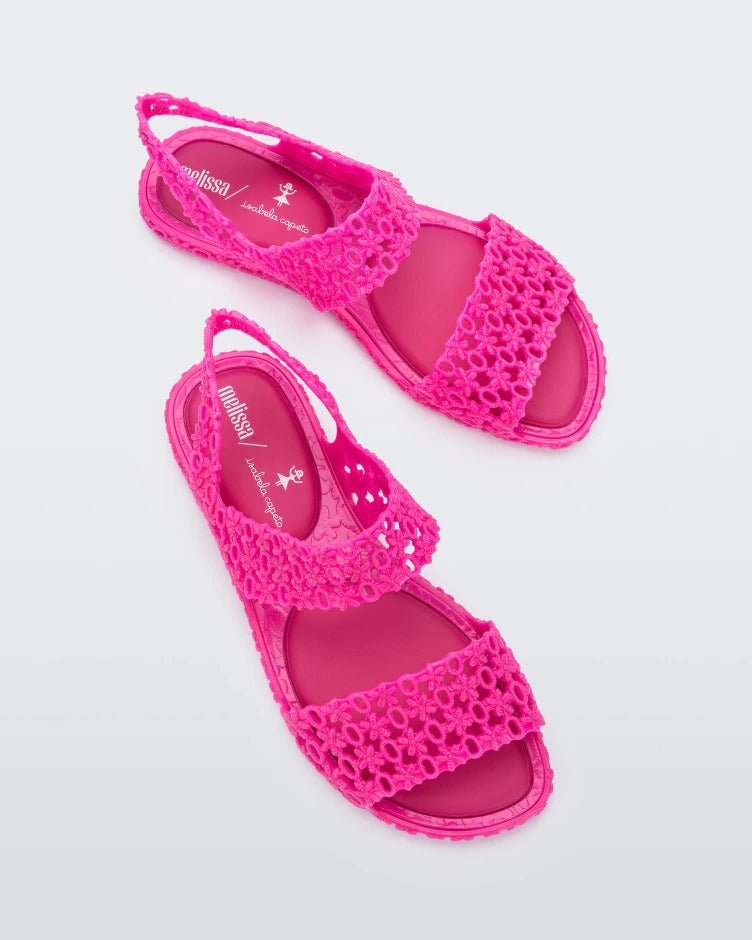 Top angled view of pair of pink Melissa Panc sandals.