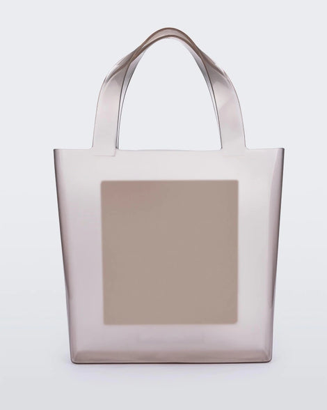 An Adult Melissa Canvas + Tarsila Do Amaral Bag with a white square in the middle.