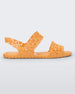Side view of a pair of yellow Melissa Panc Sandals.