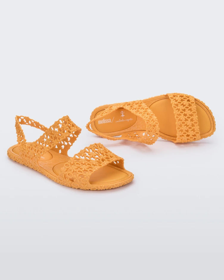 Top and side view of a pair of yellow Melissa Panc Sandals.