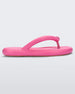 A side view of a pink Melissa Free Flip Flop with puffer-like straps.