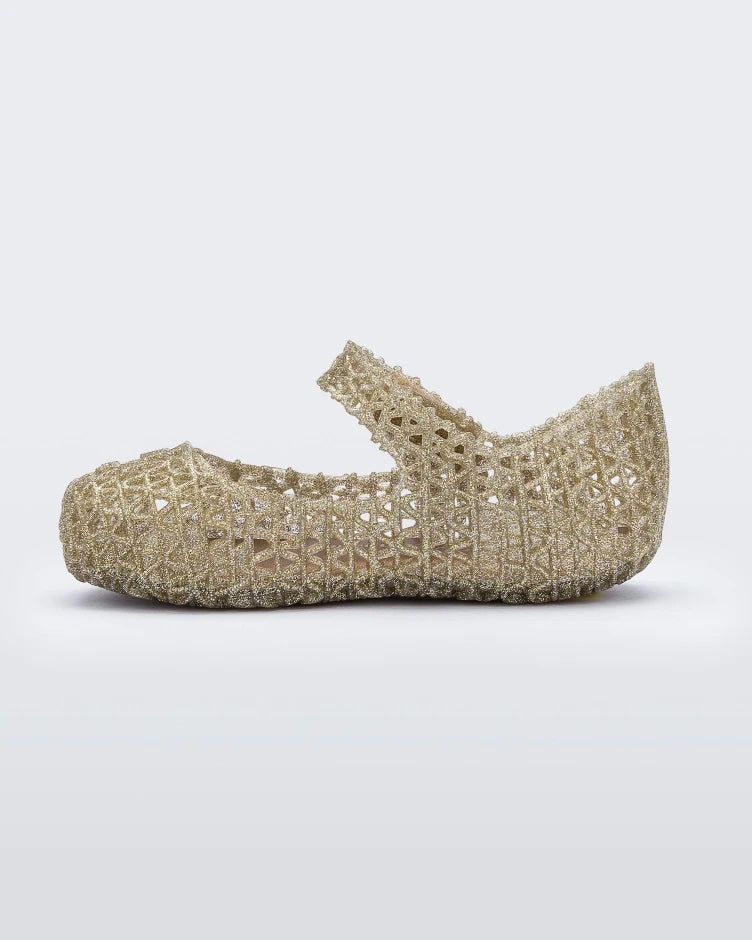 Inside view of Mini Melissa Campana gold glitter flats with a snap strap for baby with an open woven texture