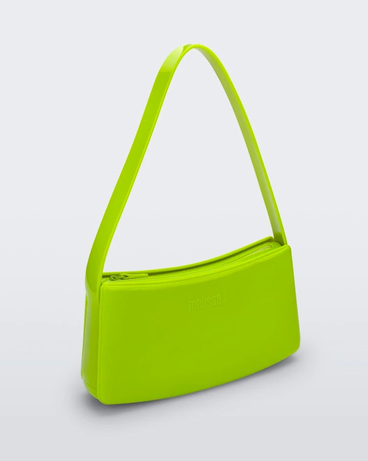 Angled view of neon green Melissa Baguete handbag.