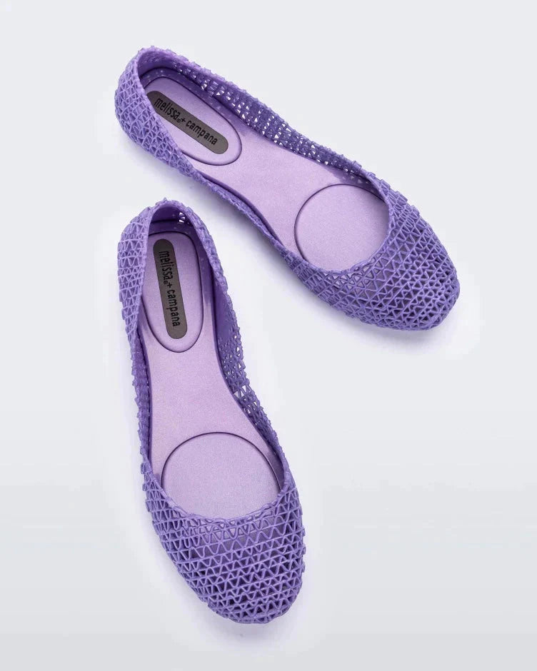 Overhead view of a pair of Melissa Campana flats in metallic lilac.