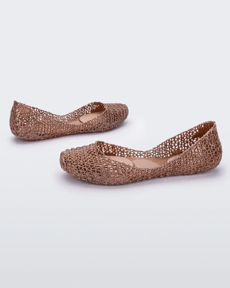 Angled view of a pair of metallic rose Melissa Campana ballet flats. 