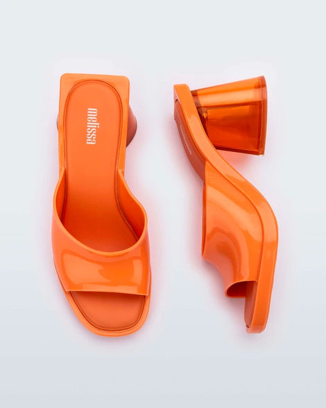 Side and top view of a pair of orange Candy heels