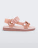 Side view of a pair of pink Melissa Papete sandals.