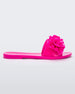 Side view of a neon pink Melissa Babe Garden slide with two flowers on the front strap.