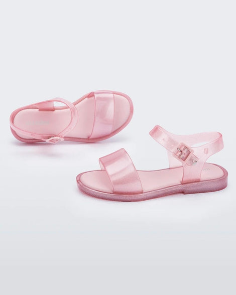 Top and side view of a pair of pink glitter Mini Melissa Mar Sandals.