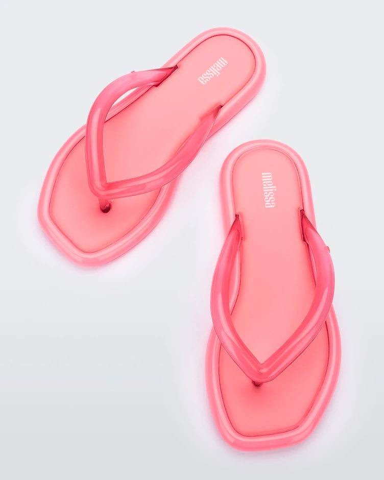 Top view of a pair of pink Melissa Airbubble Flip Flops.