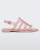 Side view of a transparent glitter pink Melissa Boemia sandal with straps conjoining in the front and a back buckle.