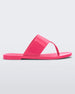 Side view of a pink Melissa Essential Chic Flip Flop with a wide upper strap.