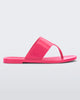 Side view of a pink Melissa Essential Chic Flip Flop with a wide upper strap.