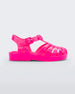 An outter side view of a pink Mini Melissa Possession sandal with several straps and a closed toe front.