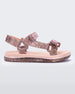 Side view of pink Mini Melissa Papete sandals with glitter straps.