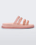 Side view of a pink/clear pink Melissa Soft Wave Slide with 4 straps: two pink and two clear pink.