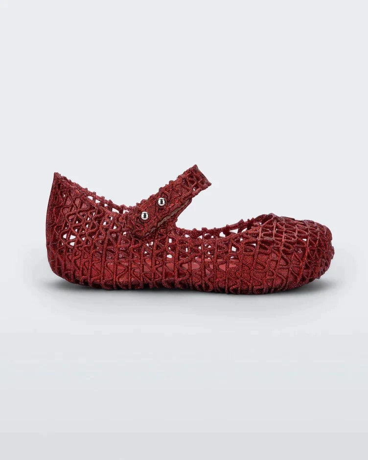 Inside view of Mini Melissa Campana red glitter flats with a snap strap for baby with an open woven texture