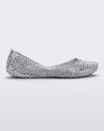 Side view of a silver glitter Melissa Campana ballet flat.