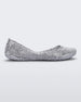 Side view of a silver glitter Melissa Campana ballet flat.