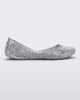 Side view of a silver glitter Melissa Campana ballet flat.