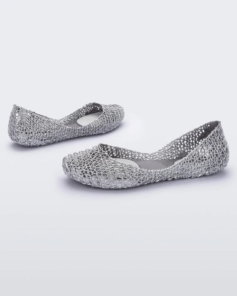 Angled view of a pair of silver glitter Melissa Campana ballet flats.