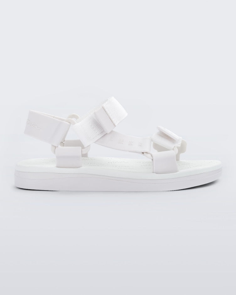 Side view of a white Melissa Papete sandal with straps.