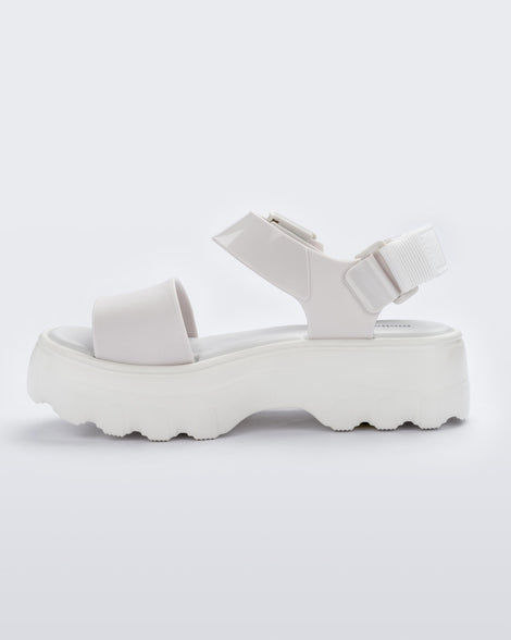 An inner side view of a white Melissa platform Kick Off sandal with two straps.