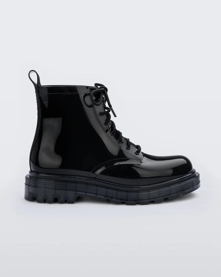 Outer side view of a pair of black Melissa Coturno boot with a black base, laces and sole.