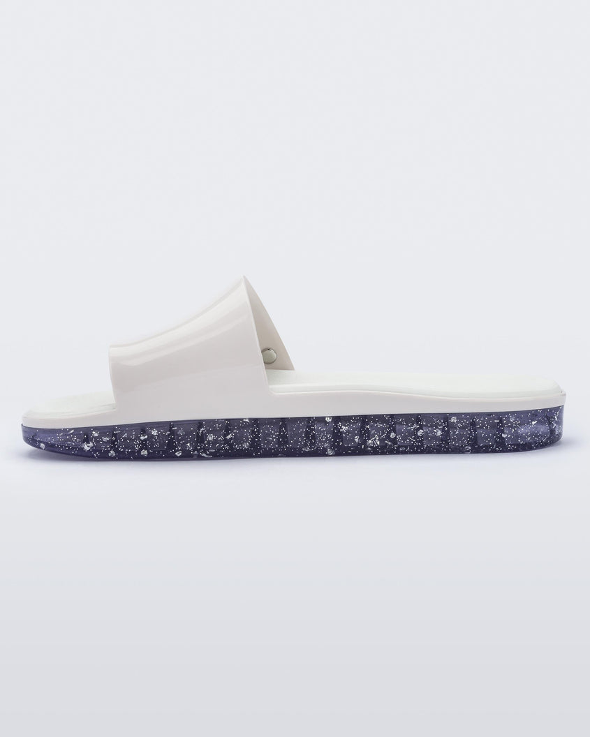 Inside view of a white Melissa Beach slide with clear/glitter sole. 