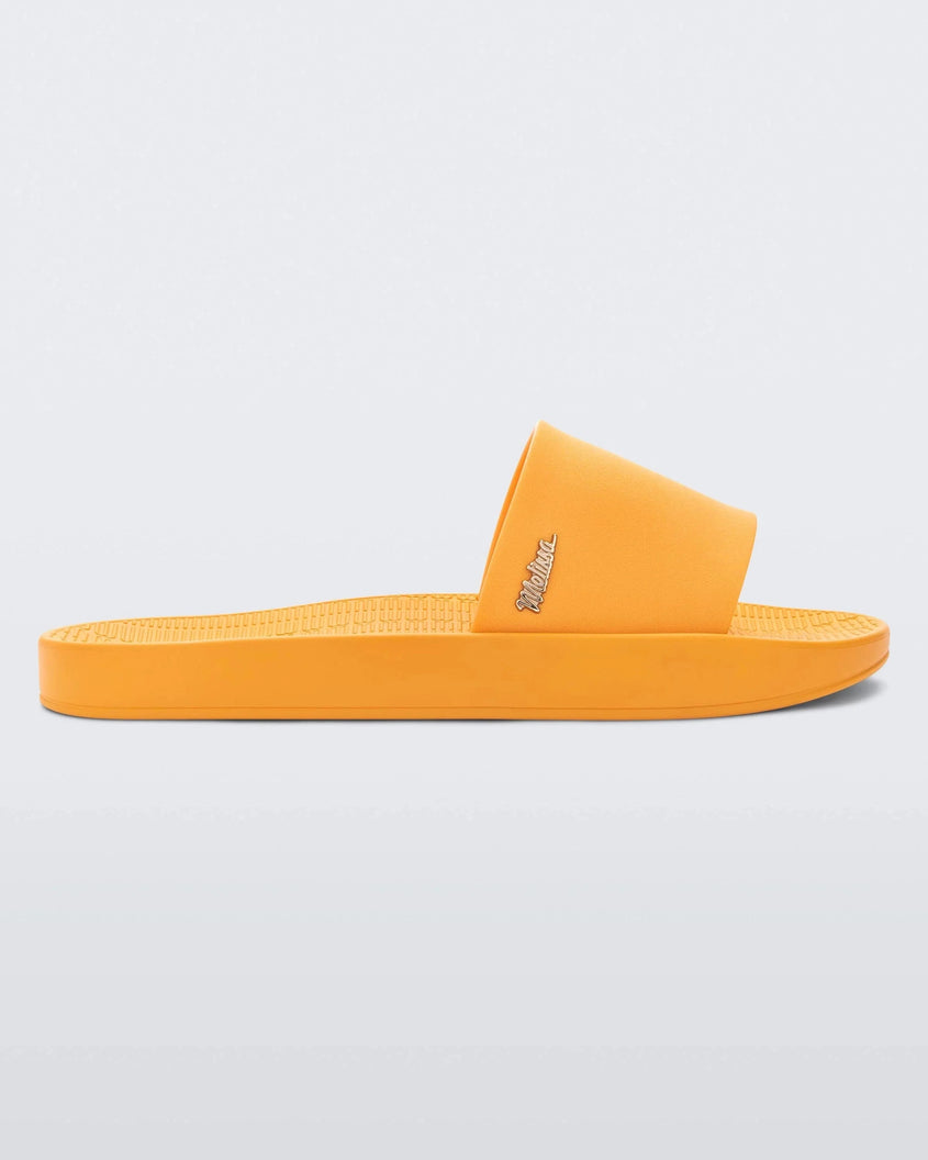 Side view of a yellow Melissa Sun Sunset slide with a melissa logo on the side.