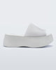 Side view of a white Melissa Becky platform slide. 