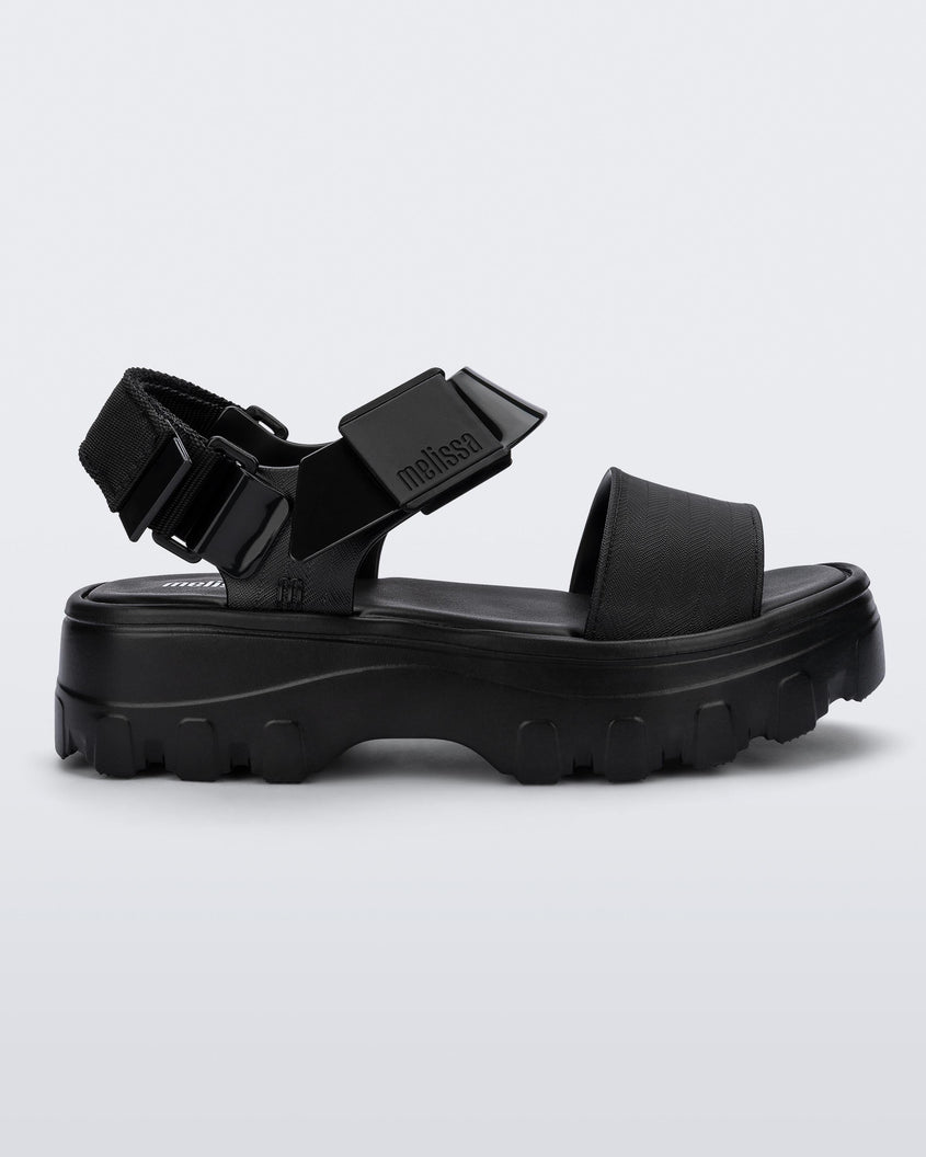 Side view of a black Melissa platform Kick Off sandal with two straps.