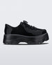 Side view of a black platform Melissa Kick Off Sneakers with laces.