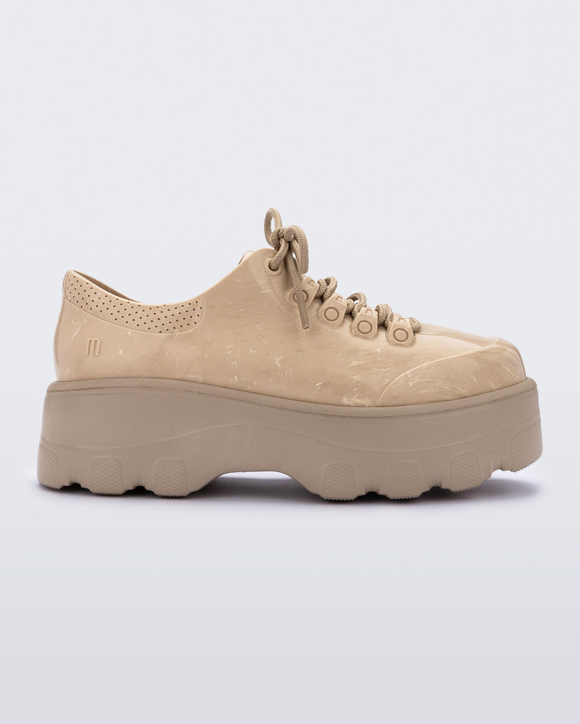 Side view of a beige platform Melissa Kick Off Sneakers with laces.