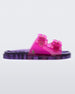 An outter side view of a pink/lilac Mini Melissa Wide Slide with a pink top with two pink buckles and a lilac sole.