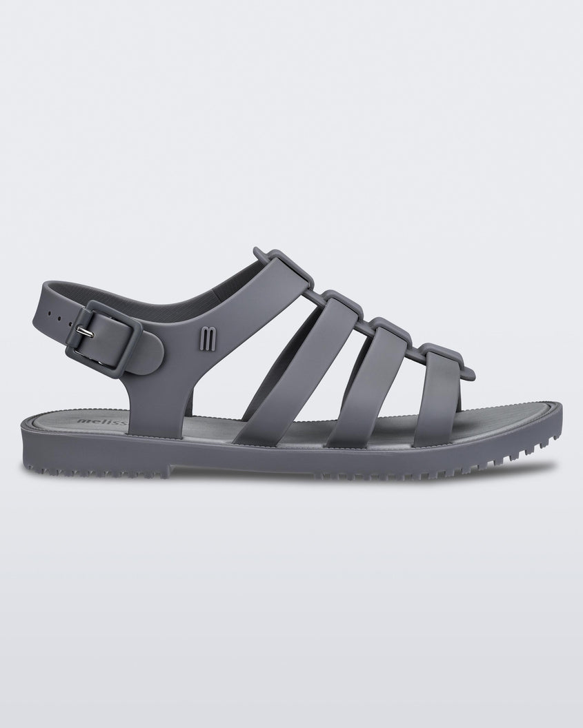 Side view of a dark gray Melissa Flox sandal with straps.