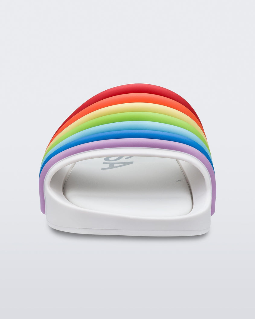 Front view of a white rainbow Melissa Rainbow Beach slide with a white sole and a rainbow top strap.