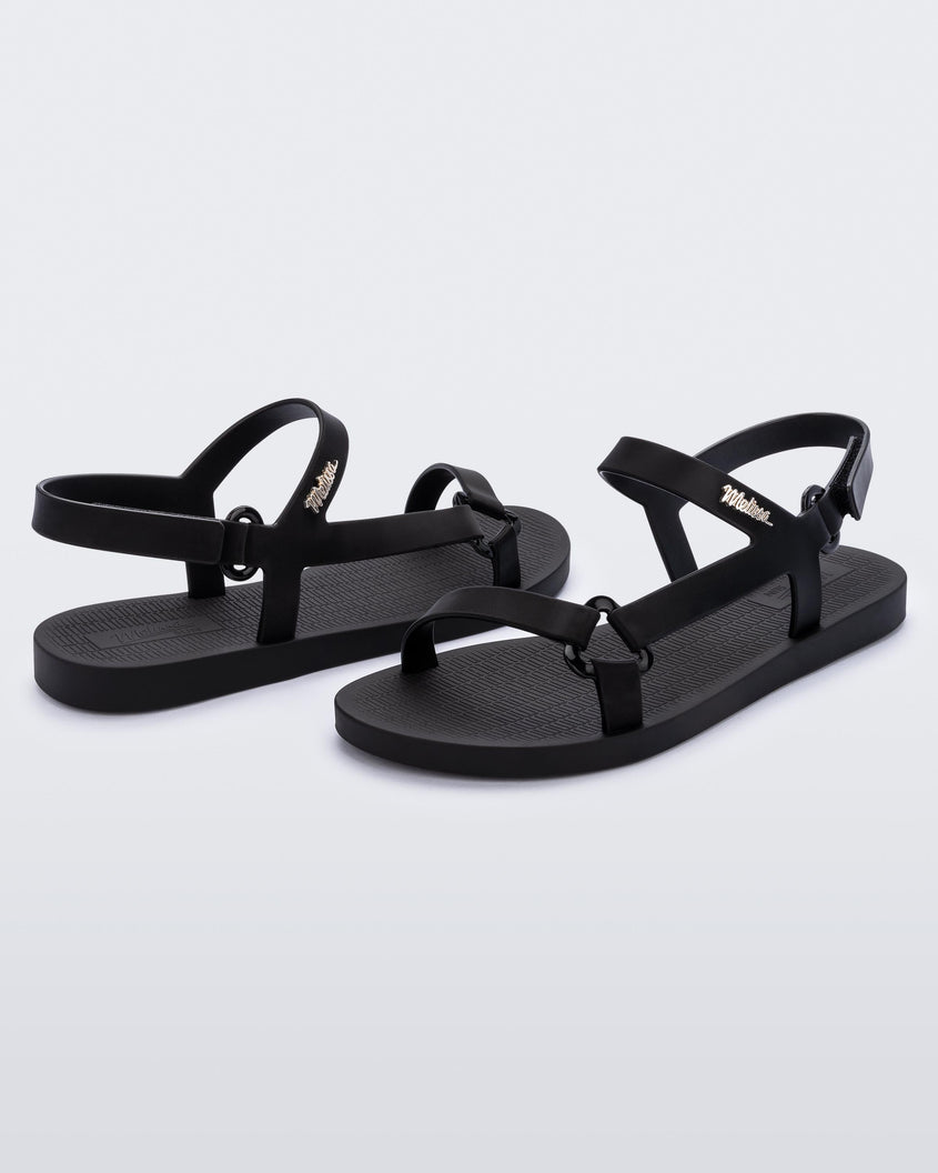 Angled view of a pair of the Melissa Sun Downtown sandals in black.