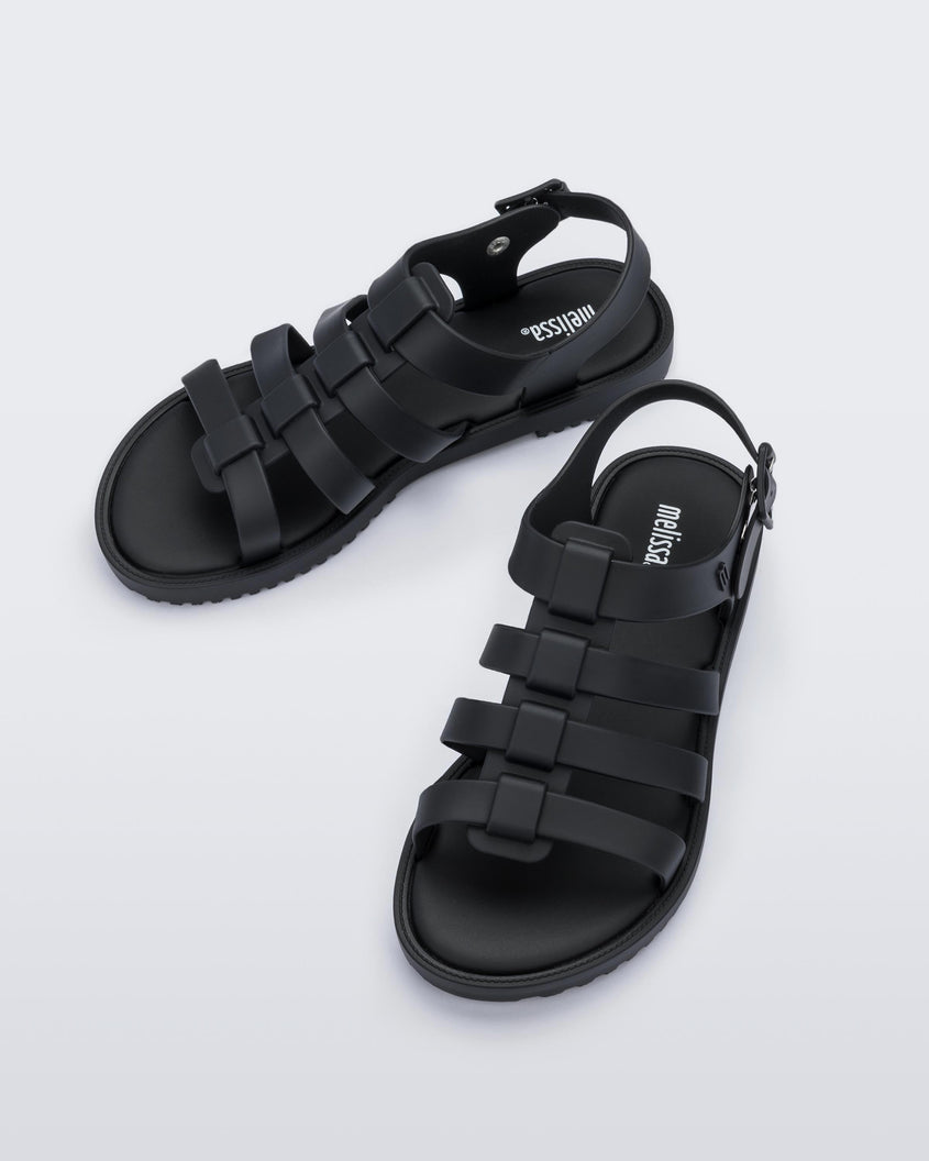 Top view of a pair of black Melissa Flox sandals with straps.